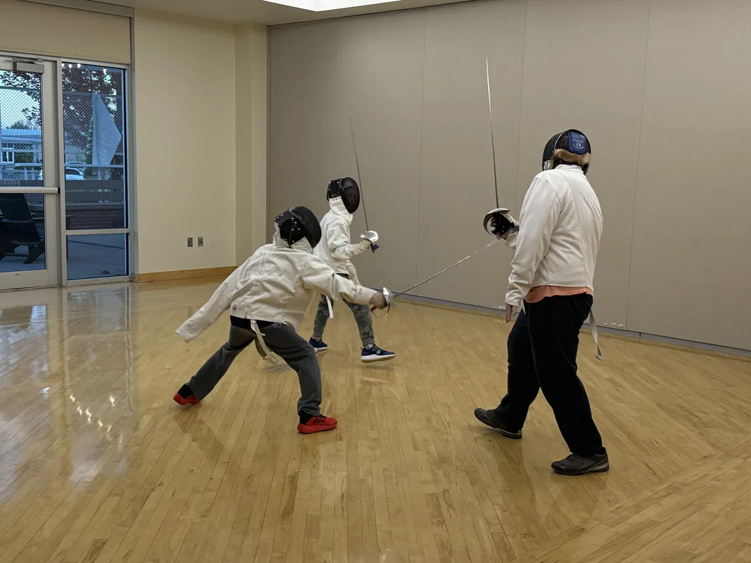 victor demonstrating lunge to students in class
